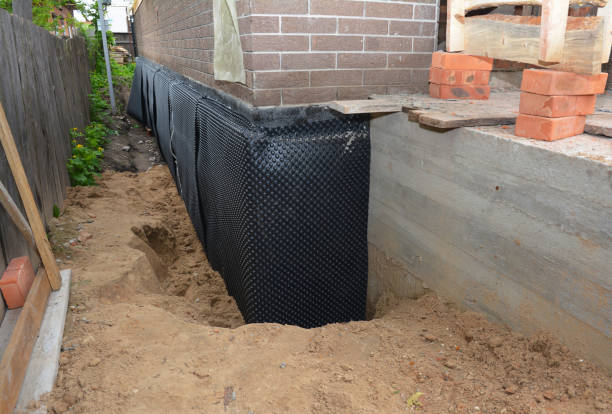 Happy homeowners after waterproofing job in Unicoi